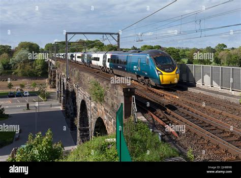 Avanti West Coast Alstom Pendolino Train Crossing Carlisle Bridge