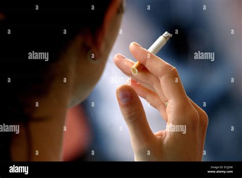 Woman Smoking Cigarette Rear View To Hand Holding Cigarette Stock