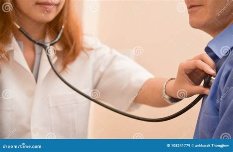 Female Doctor Examining Senior Male Patient Stock Image Image Of