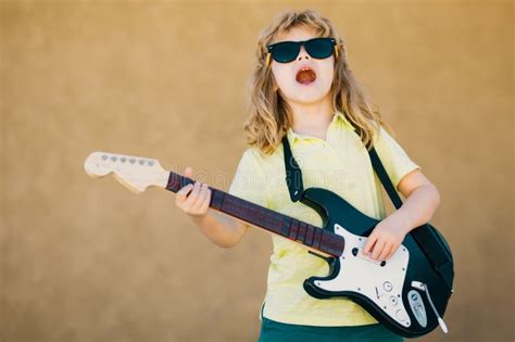 Child Musician Guitarist Playing Electric Guitar Kid Boy With Guitar