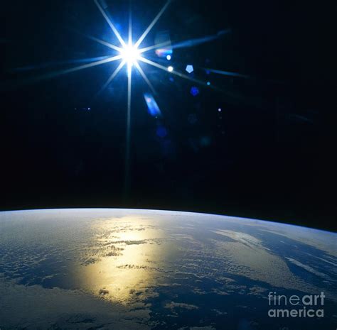 A Star Shining On Planet Earth Photograph By Stocktrek Images