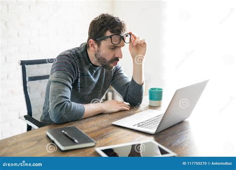 Man Looking Closely At His Laptop Stock Photo Image Of Office News
