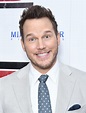 Chris Pratt jokes with photographers as he hunks out in grey suit at ...
