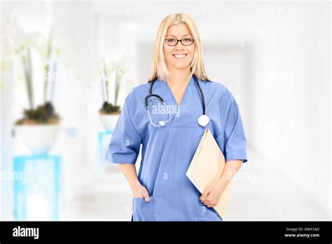 Young Female Doctor Standing In A Hospital Corridor Stock Photo Alamy