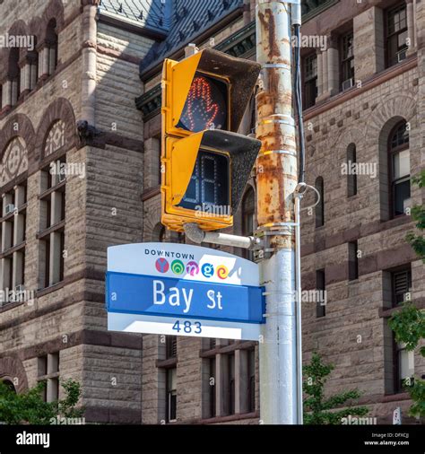 Downtown Yonge Bay Street Sign And Yellow Pedestrian Crossing Light