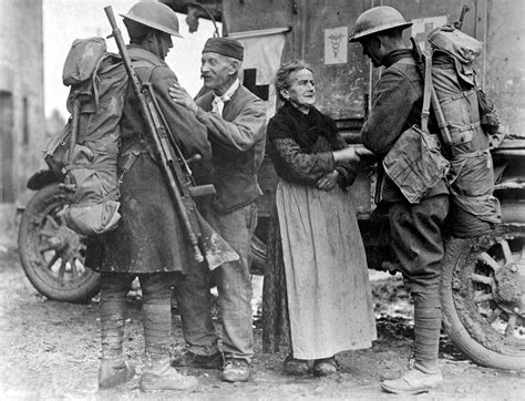 Two Newly Liberated French Civilians Greeting Two American Soldiers In