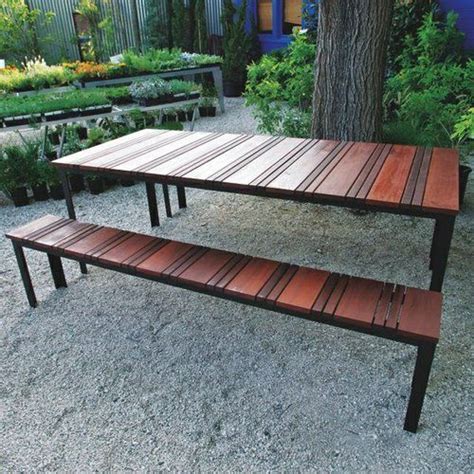 It can seat six people at one time. SOL Outdoor Dining Table and Outdoor Bench Set by Sarabi ...