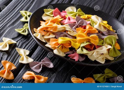 Traditional Italian Colored Farfalle Paste Close Up On A Plate Stock