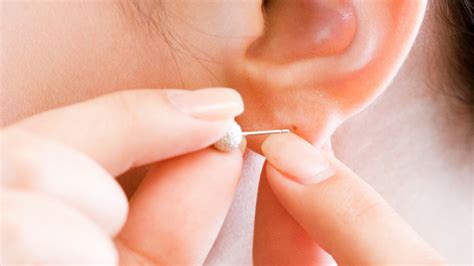 What It Really Means When Your Ear Piercings Begin To Smell