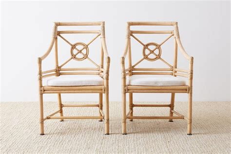 This famous motif can be customized with a contrasting finish on the inner, outer or both rings. Pair of McGuire Rattan Target Design Lounge Chairs For Sale at 1stdibs