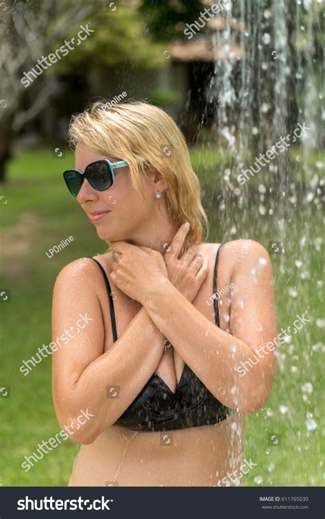 Sexy Blonde Woman Taking Outdoor Shower Stock Photo