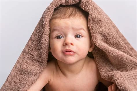 Baby Under Towel Stock Photo By ©erstudio 64389389