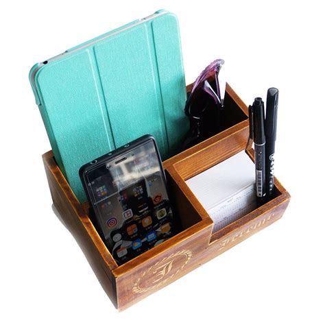 A Cell Phone And Pen Are In A Wooden Desk Organizer With Two