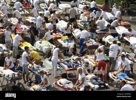 300 ukrainian masseurs and masseuses perform simultaneous massage in an attempt to break the