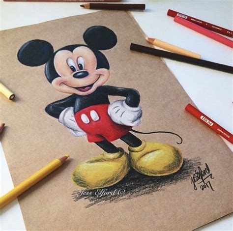 A Drawing Of Mickey Mouse With Colored Pencils Next To It