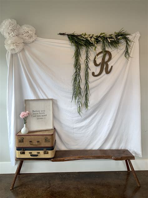 It really made for a great focal point and hot spot. Baby shower photo wall | Baby shower photos, Ladder decor ...