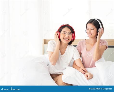 Asian Cute Lesbian Couple Girl Listening Music And Popular Song In