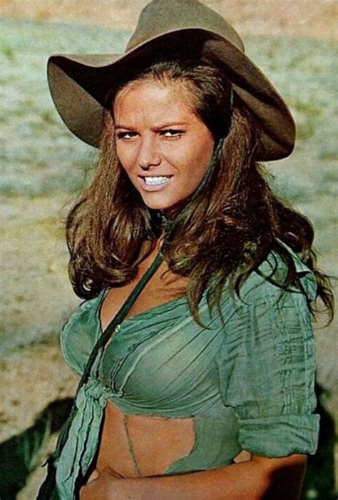 A Woman Wearing A Cowboy Hat And Green Shirt