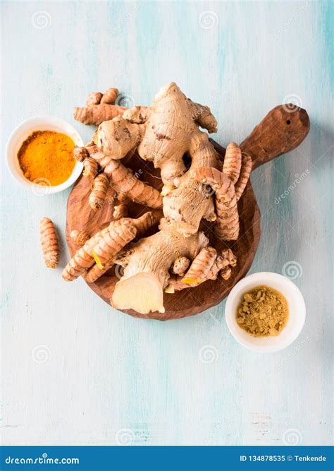 Turmeric And Ginger In Powder And Roots On Board Stock Image Image Of