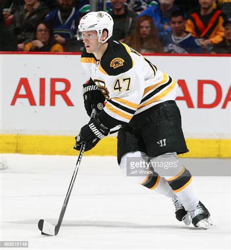 Torey Krug Of The Boston Bruins Skates Up Ice With The Puck During