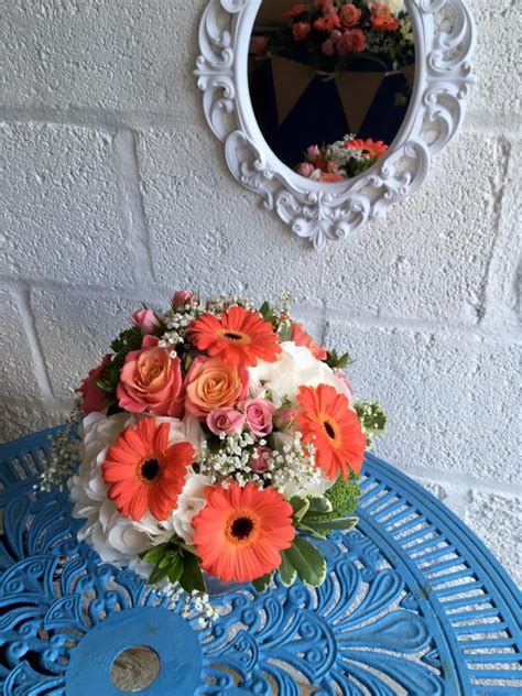 The delicate bridal bouquet below (left) is from the wedding and is composed of pink roses, orchids. coral and cream wedding bouquet. Using gerberas, hydrangea ...