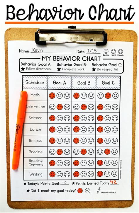 A Behavior Chart On A Clipboard With An Orange Marker And Pen Next To It