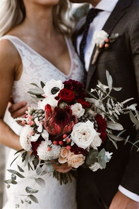 These boutonnieres of plum, dusty purple, and cranberry roses with vibrant greenery completely nailed the aesthetic. Winter Wedding Flowers: 23 Winter Wedding Bouquets ...