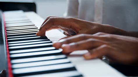 Close Up Of Pupil With Teacher Playing Piano Stock Footage Sbv