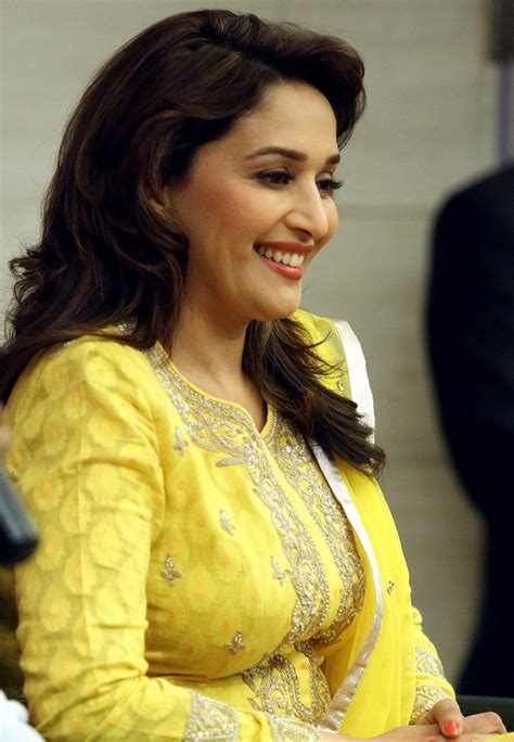 Beautiful Actress Madhuri Dixit In Yellow Beauty Dress In Interview