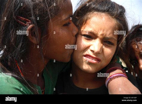 Young Indian Street Girl Kissing Her Friend On The Cheek On The Road To Diu Gujarat India