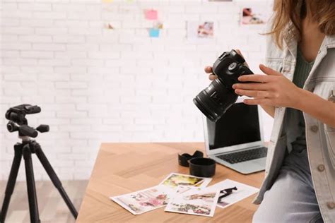 Professional Photographer With Camera Working In Office Closeup Stock