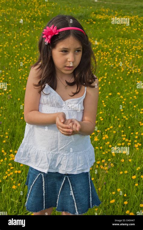 A Girl 7 Years Old In A Field Of Buttercups Stock Photo Alamy