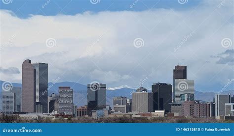 The Skyline Of Denver Colorado With Rocky Mountains In The Distance