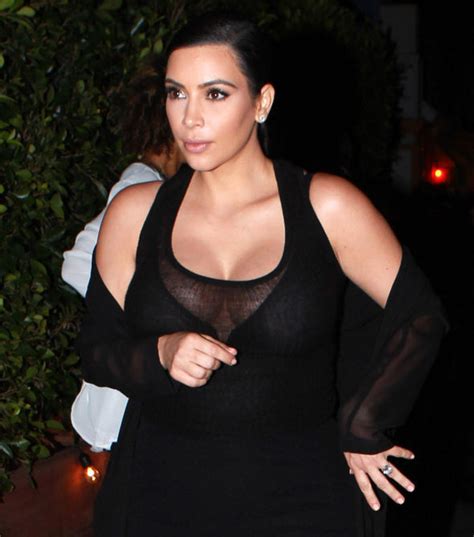 Pregnant Kim Kardashian Flashes Her Cleavage In Plunging Black Top And