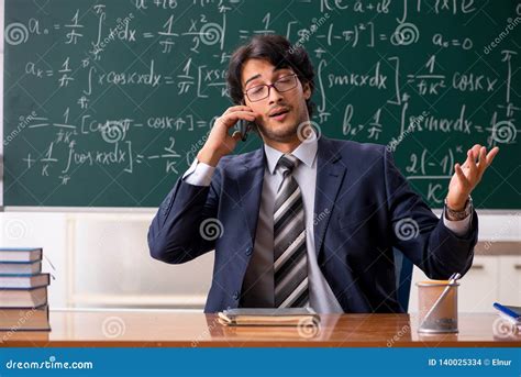 The Young Male Math Teacher In Classroom Stock Photo Image Of Green