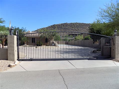 A front gate announces your intentions with its proportions, style, and materials. iron-front-gate-4 - Phoenix Door Inc.