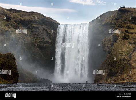 Man Staring At Skogafoss Waterfall Hi Res Stock Photography And Images