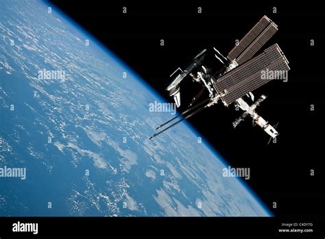 Space Shuttle Endeavour Docked To The International Space Station Stock