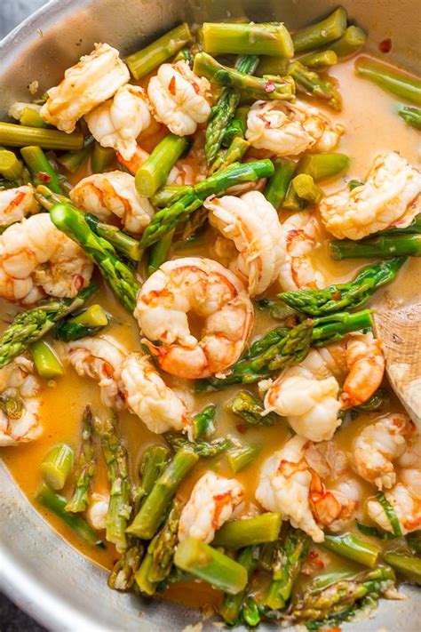 Aside from the oil to cook it in, it's got only five ingredients and is ready in about fifteen minutes from start to finish. Lemon Garlic Shrimp and Asparagus | Recipe | Shrimp and ...