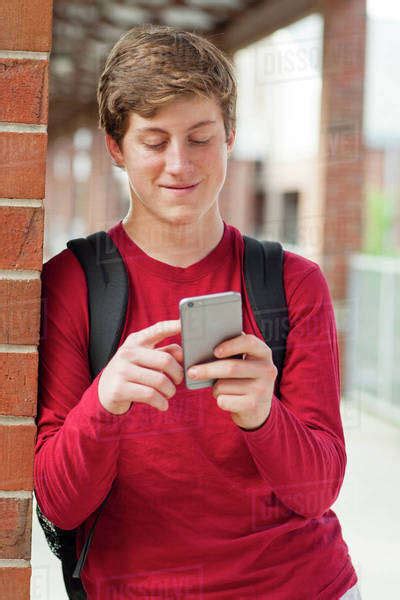 Caucasian Teenage Boy Using Cell Phone Stock Photo Dissolve