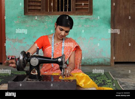 Woman Using Sewing Machine Stock Photo Alamy