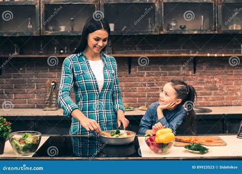 Mother And Daughter Cooking On Kitchen Stock Image Image Of Cooking Concept 89923523