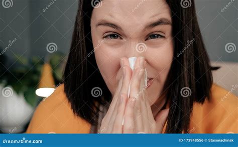 girl blows her nose attractive caucasian woman blows her nose in handkerchief and looks at