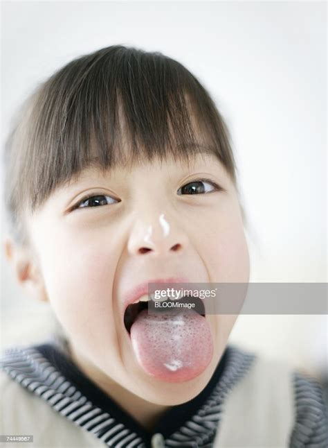 Japanese Girl Showing Cream On Tongue And Nose With Looking At Camera