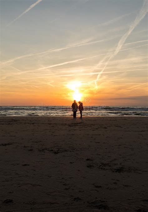 Two Women Is Looking At The Sunset On Beach In Katwijk Netherlands