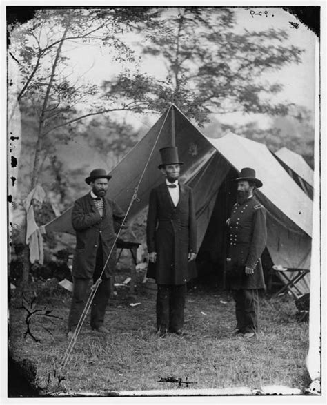 Abraham Lincoln Standing In The Battlefield During The Civil War In