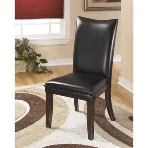 Modeled after an iconic parsons chair, ours has the signature cushioned high back and seat covered in faux leather. Ashley Furniture Charrell Faux Leather Dining Side Chair ...