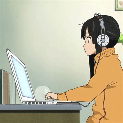 A Woman Wearing Headphones Using A Laptop Computer