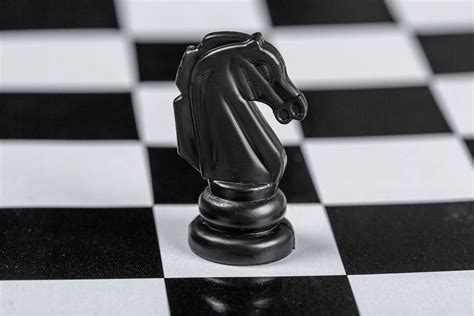 Black King Chess Piece Lies On A Chessboard The Concept Of Losing