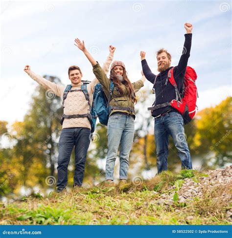 Group Of Smiling Friends With Backpacks Hiking Stock Photo Image Of